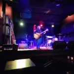 Rhe with Guitar on Stage